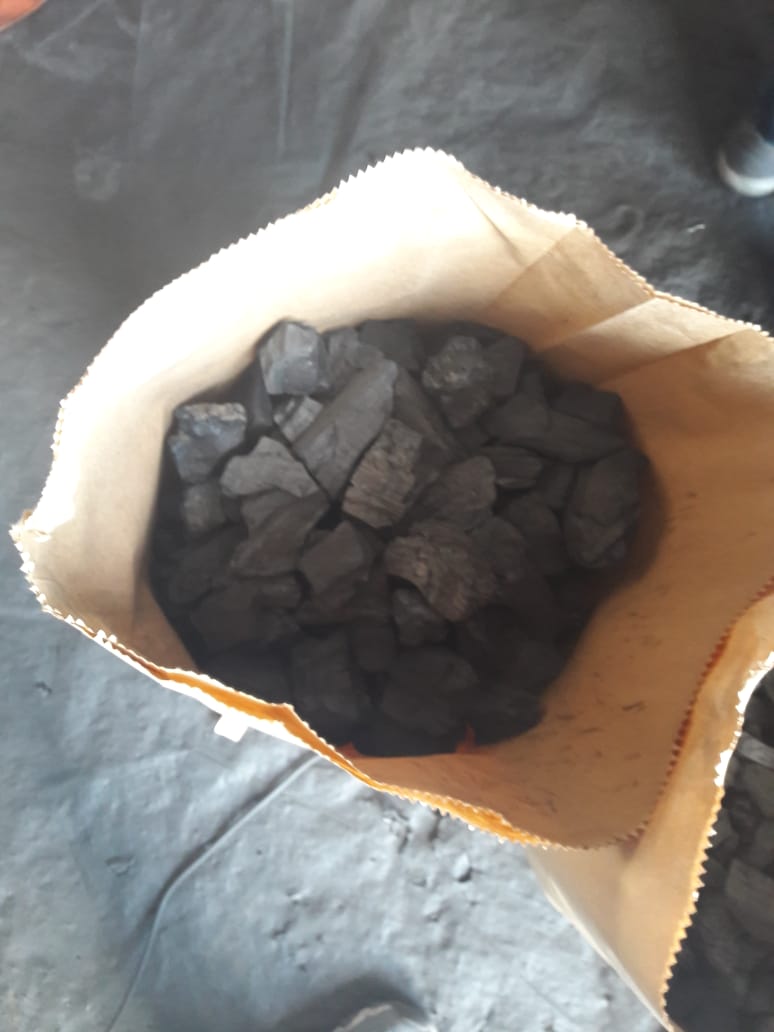 Kraft paper bag filled with quebracho shisha charcoal